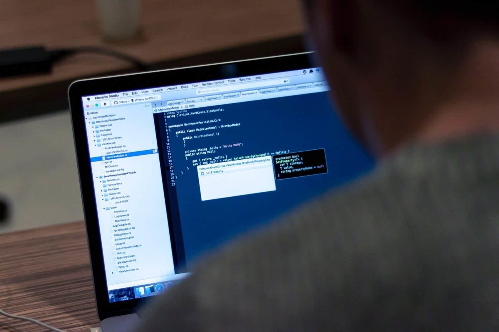 Man coding on a Macbook