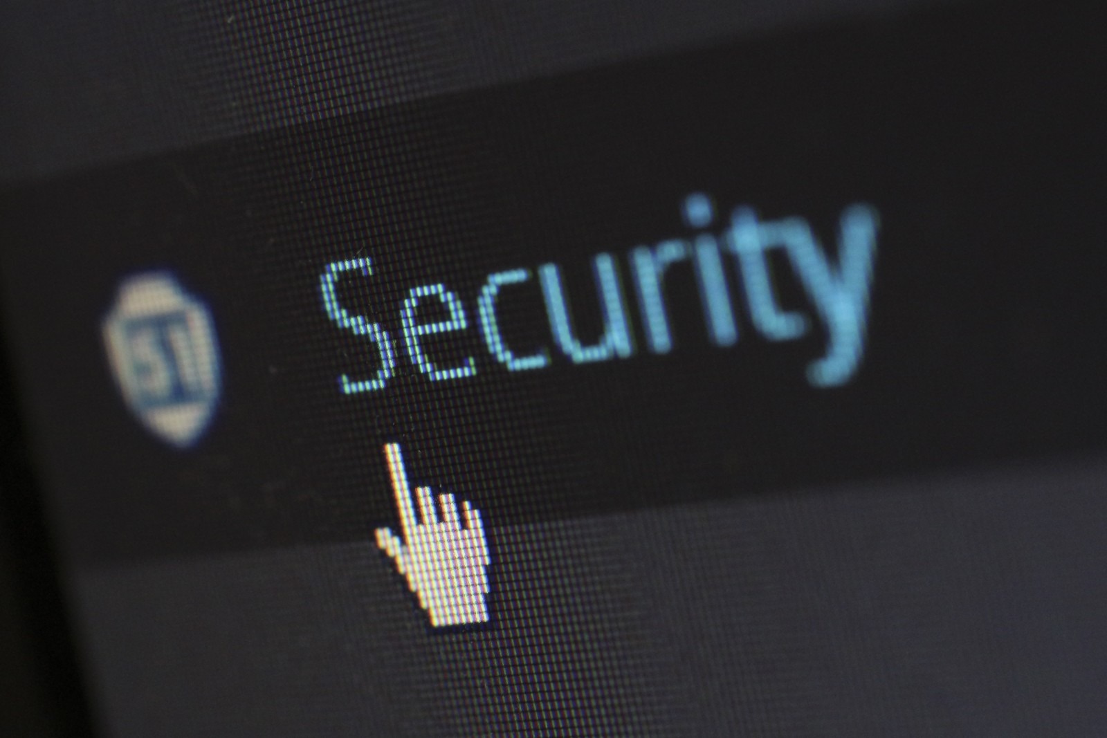 Closeup of a computer screen, mouse cursor hovering over "Security" text